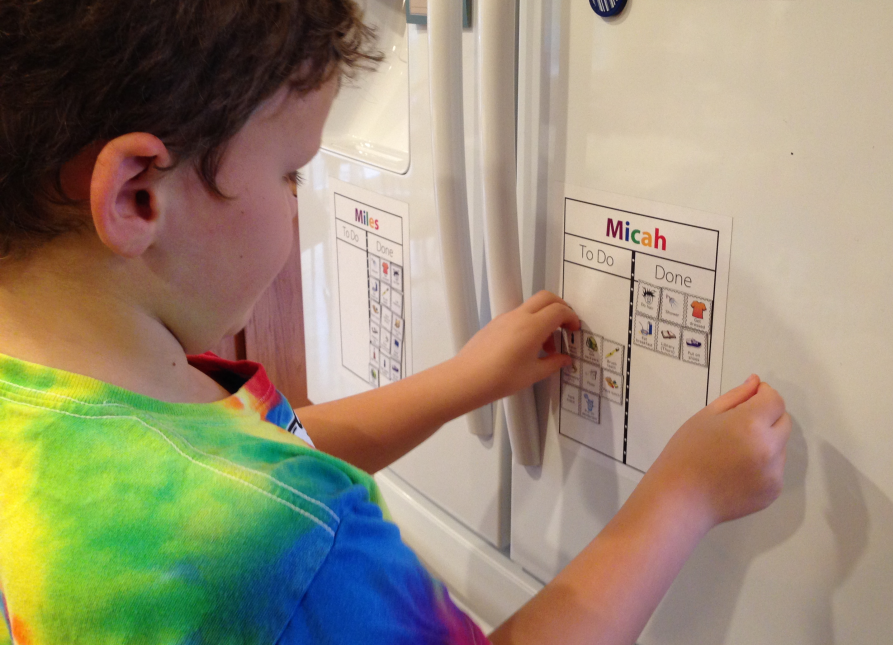 Children using personalized magnetic checklists. Comes with 20 picture magnets and ability to make your own.