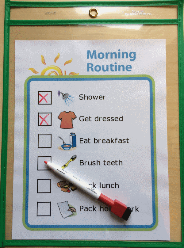 Morning routine picture checklist in a plastic sleeve with dry erase marker