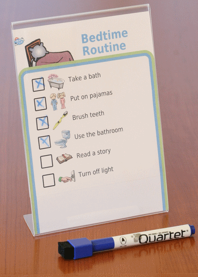 Bedtime routine picture checklist in a 5x7 plastic frame with dry erase marker
