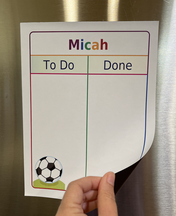White magnetic To Do / Done Board with Logan in rainbow colors