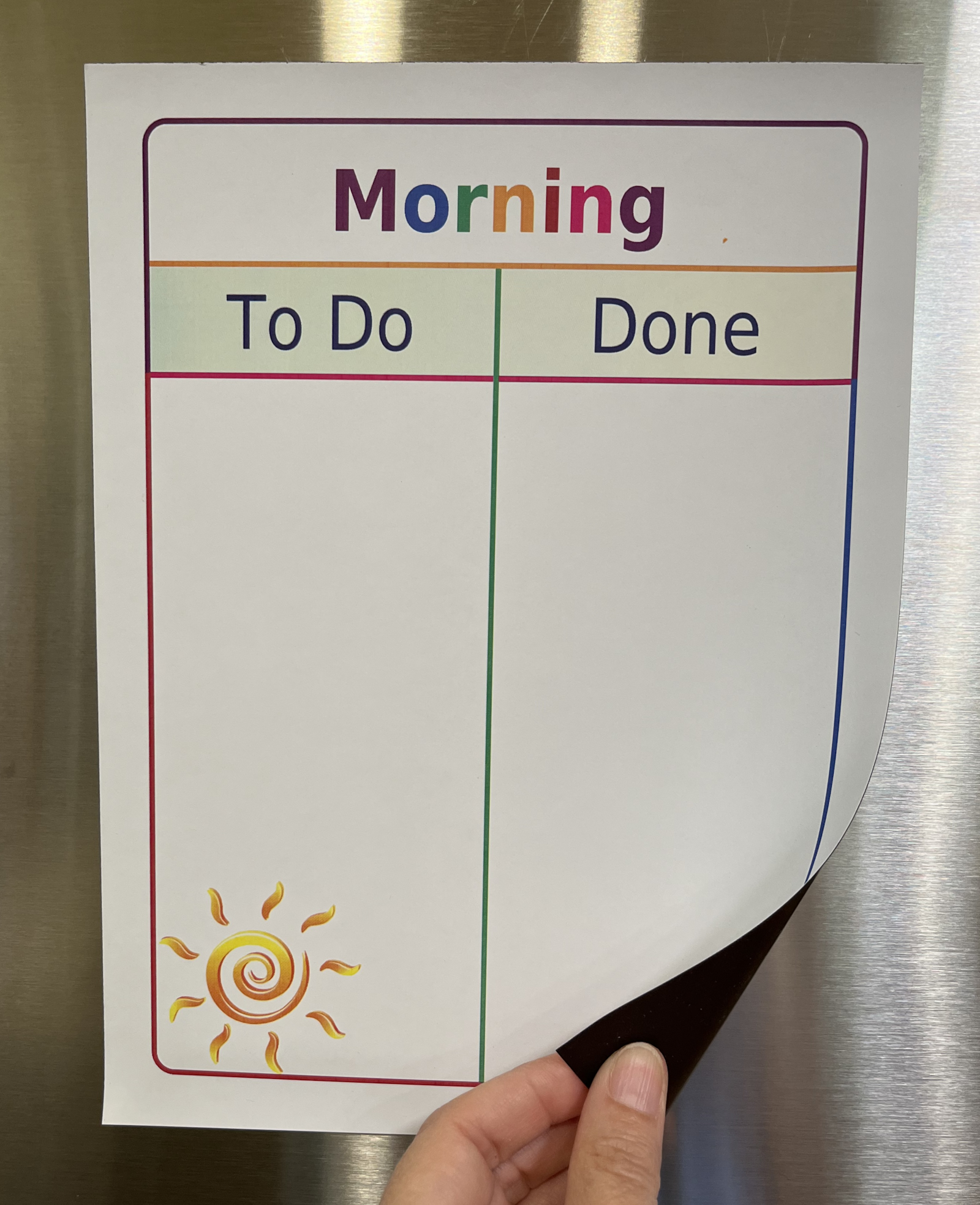 White hook and loop To Do / Done Board with Morning in rainbow colors at the top